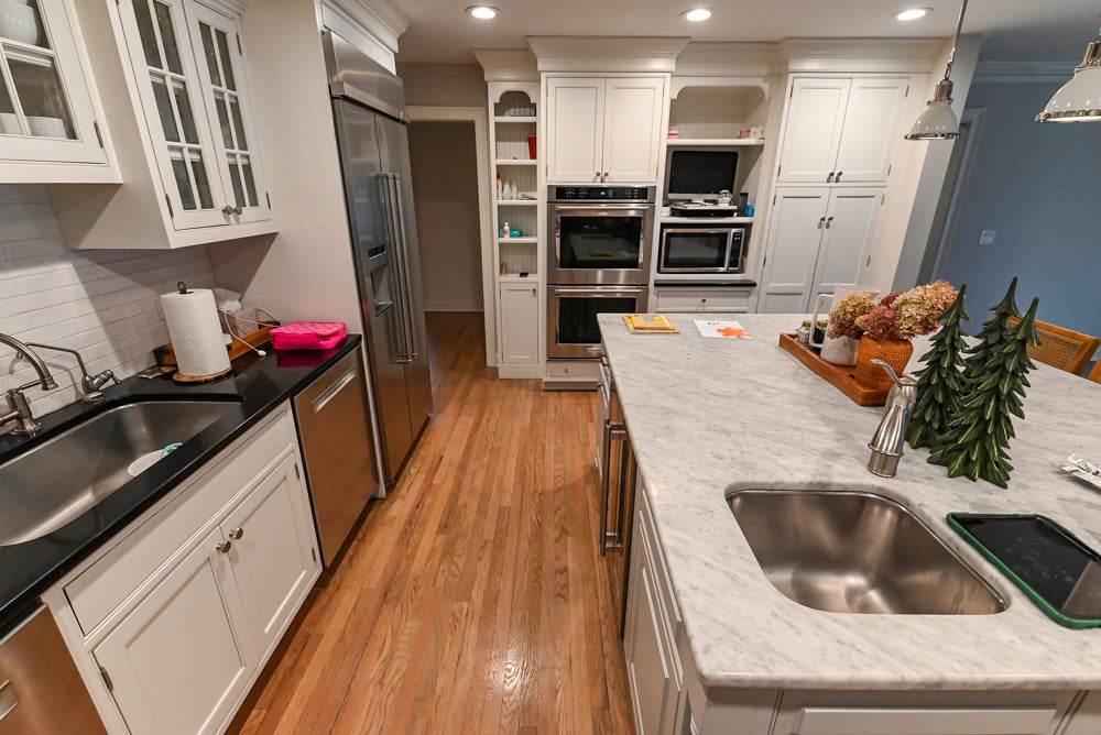 Traditional White Kitchen with Marble Top Island and Appliances