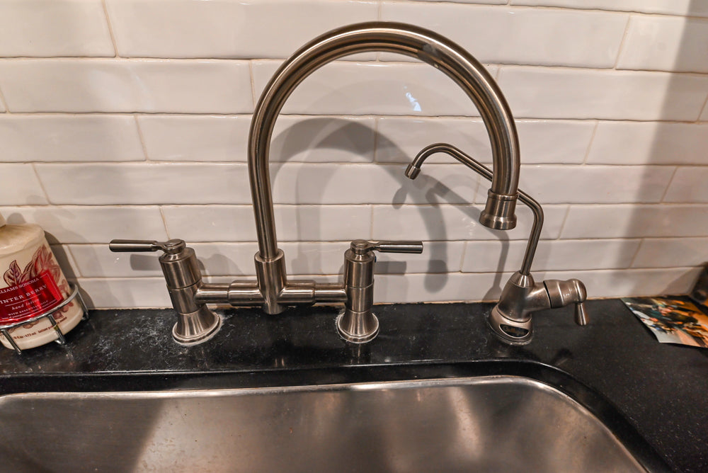 Traditional White Kitchen with Marble Top Island and Appliances