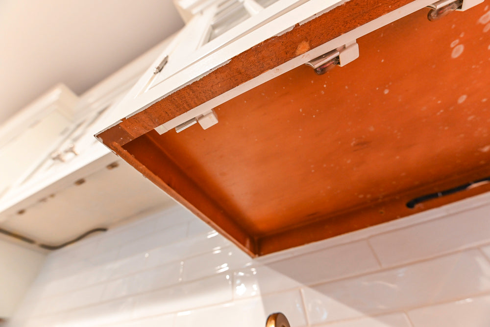 Traditional White Kitchen with Marble Top Island and Appliances