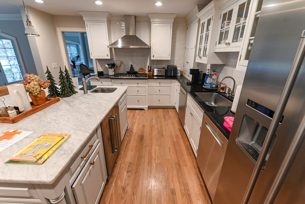 Traditional White Kitchen with Marble Top Island and Appliances