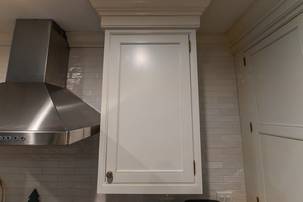 Traditional White Kitchen with Marble Top Island and Appliances