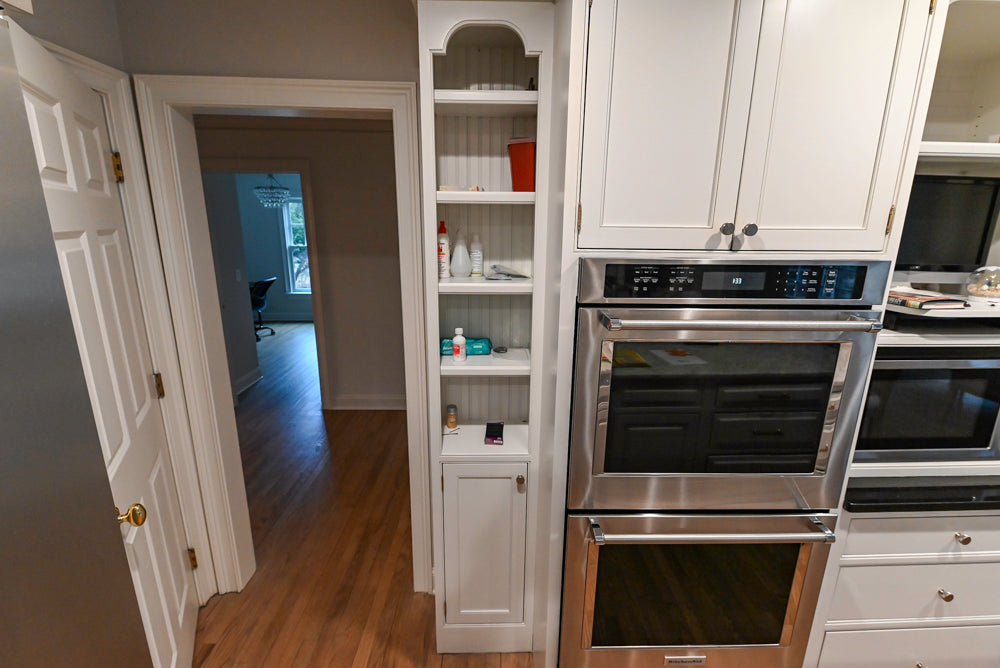 Traditional White Kitchen with Marble Top Island and Appliances
