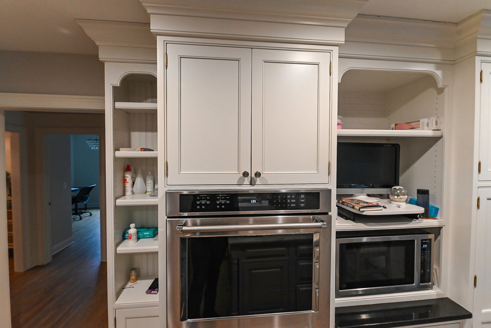 Traditional White Kitchen with Marble Top Island and Appliances