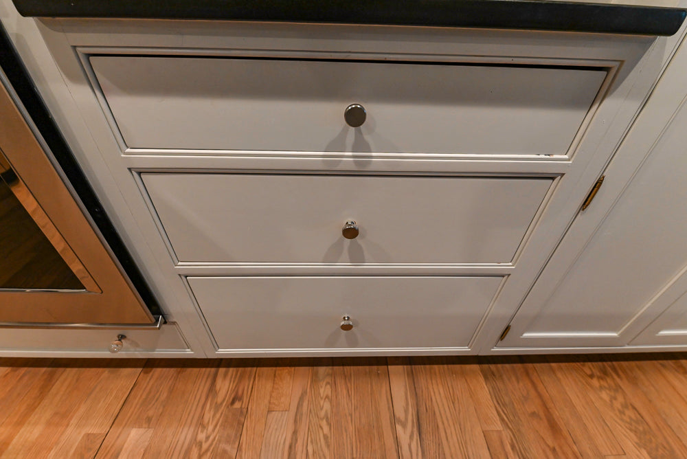 Traditional White Kitchen with Marble Top Island and Appliances
