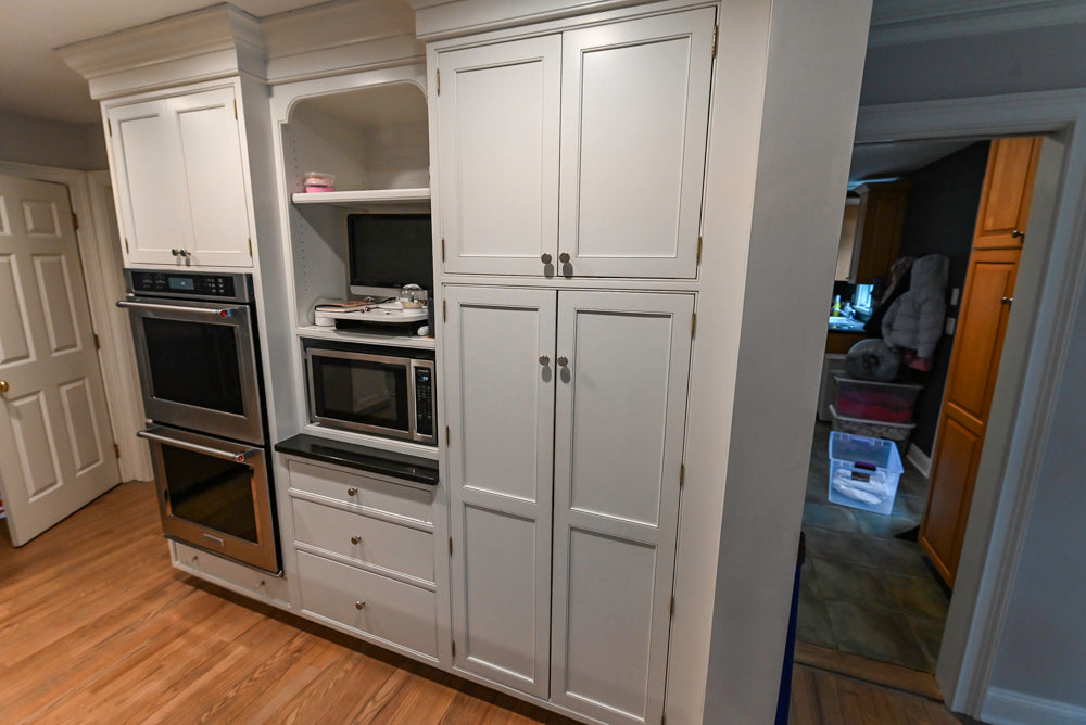 Traditional White Kitchen with Marble Top Island and Appliances