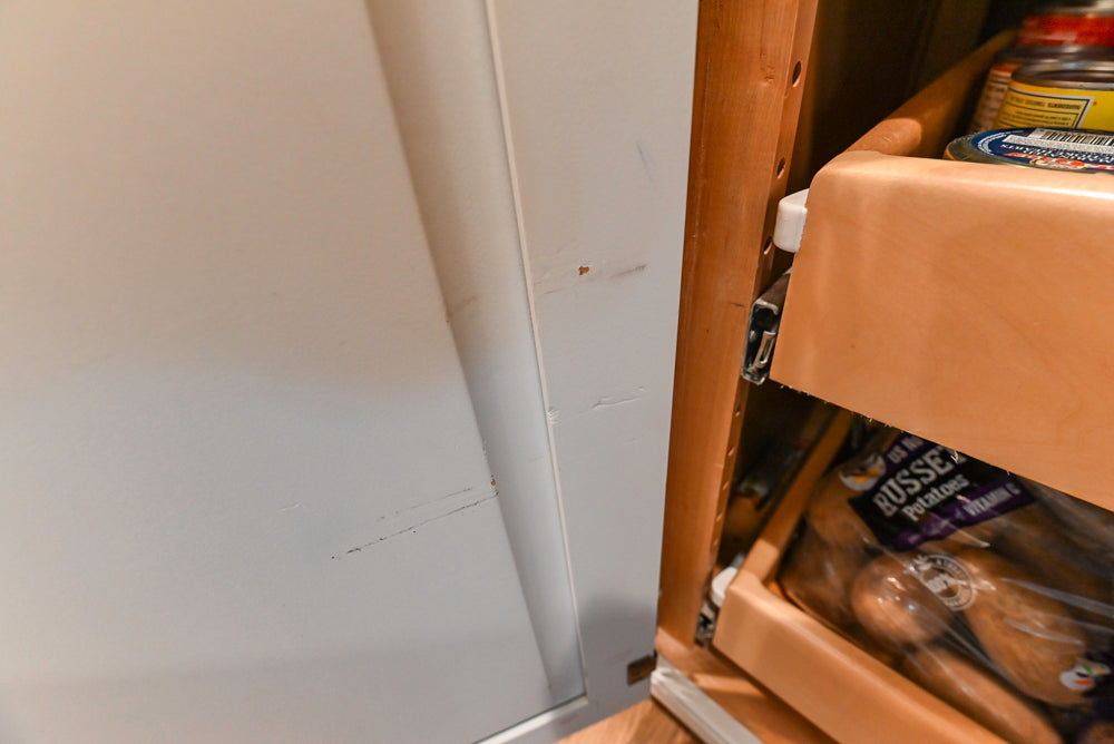 Traditional White Kitchen with Marble Top Island and Appliances