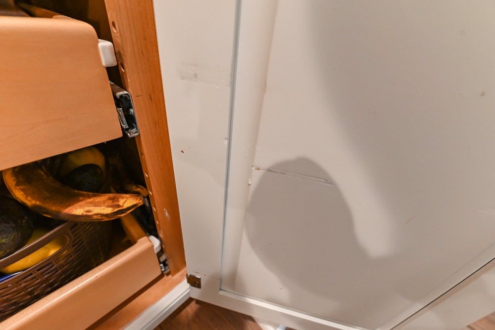 Traditional White Kitchen with Marble Top Island and Appliances