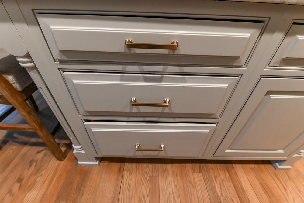 Traditional White Kitchen with Marble Top Island and Appliances