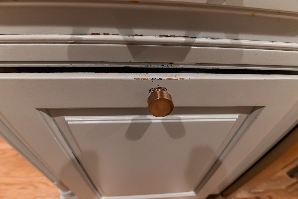 Traditional White Kitchen with Marble Top Island and Appliances