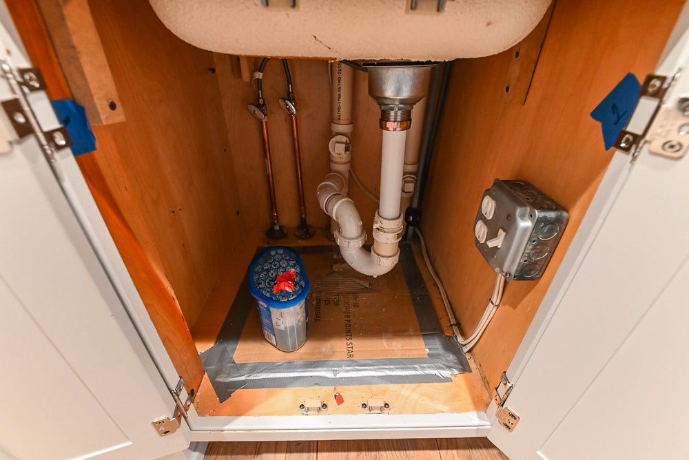 Traditional White Kitchen with Marble Top Island and Appliances
