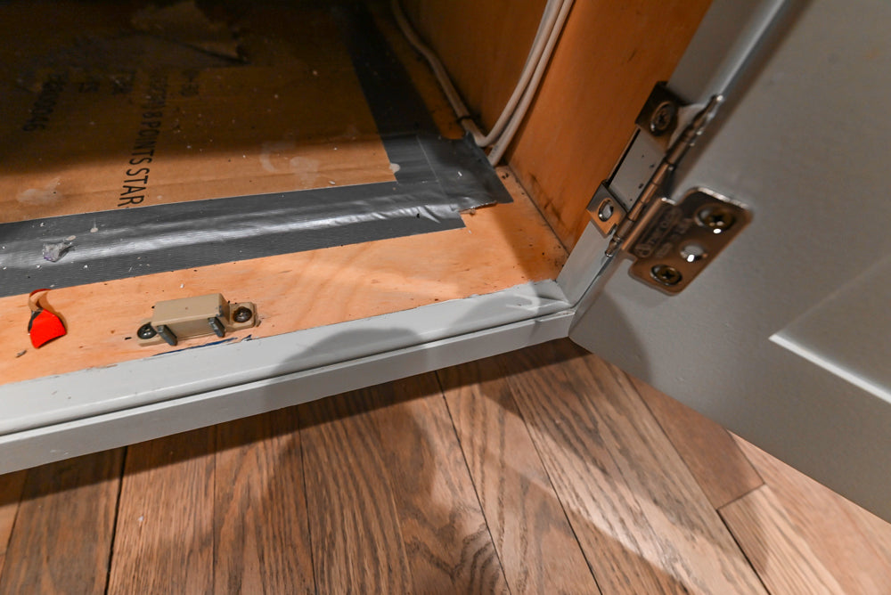 Traditional White Kitchen with Marble Top Island and Appliances