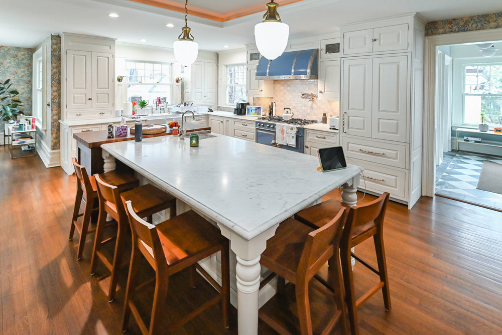 Traditional White Kitchen with Island, Marble Countertops and La Cornue Range with Matching Hood