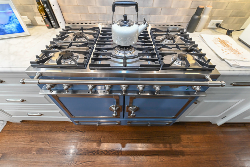Canterbury Traditional White Kitchen with Island, Marble Countertops and La Cornue Range with Matching Hood