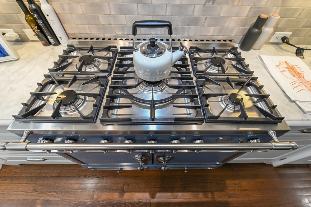 Canterbury Traditional White Kitchen with Island, Marble Countertops and La Cornue Range with Matching Hood