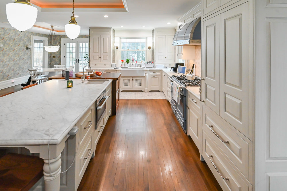 Traditional White Kitchen with Island, Marble Countertops and La Cornue Range with Matching Hood