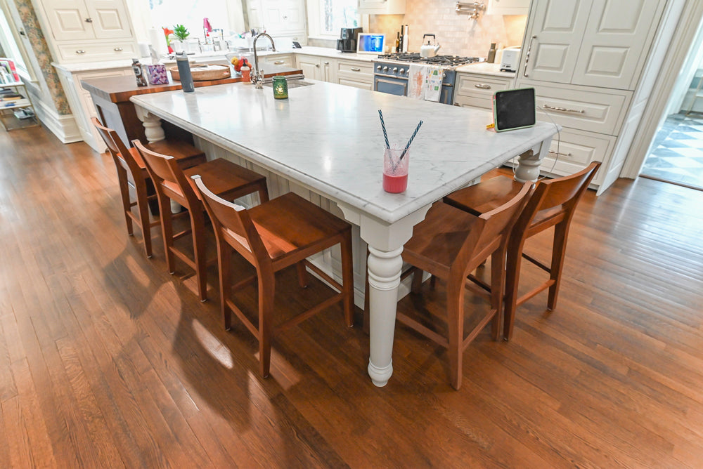 Traditional White Kitchen with Island, Marble Countertops and La Cornue Range with Matching Hood