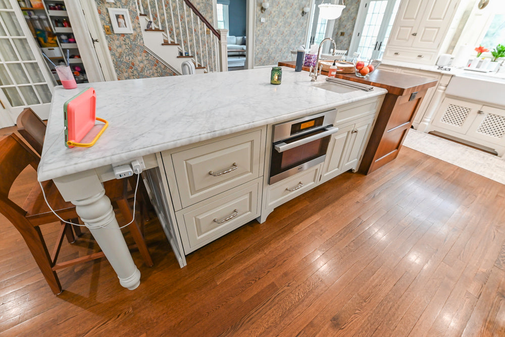 Traditional White Kitchen with Island, Marble Countertops and La Cornue Range with Matching Hood