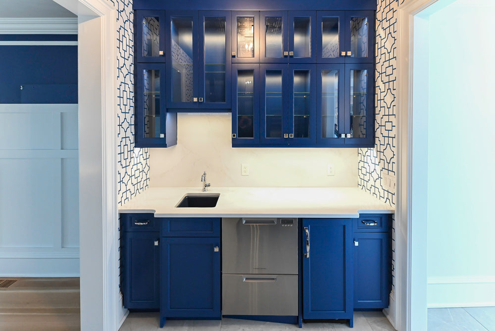 Gemcraft Navy Blue Pantry with White Quartz Countertops and Sub-Zero Tall Wine Cooler