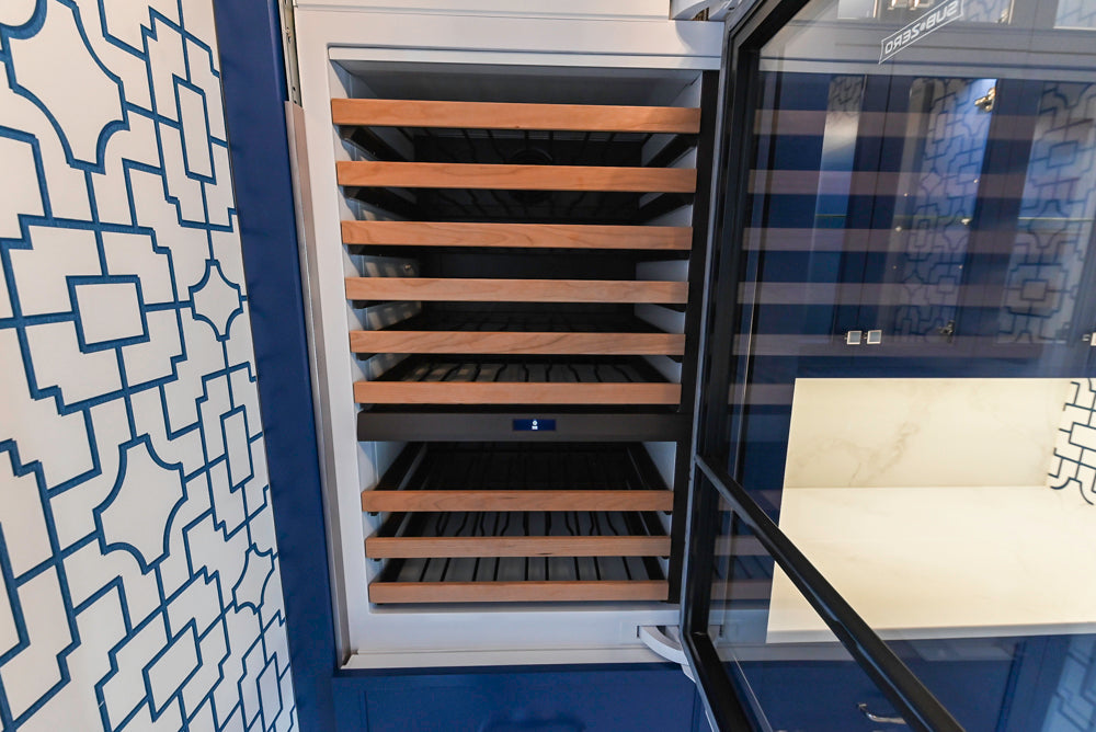 Gemcraft Navy Blue Pantry with White Quartz Countertops and Sub-Zero Tall Wine Cooler
