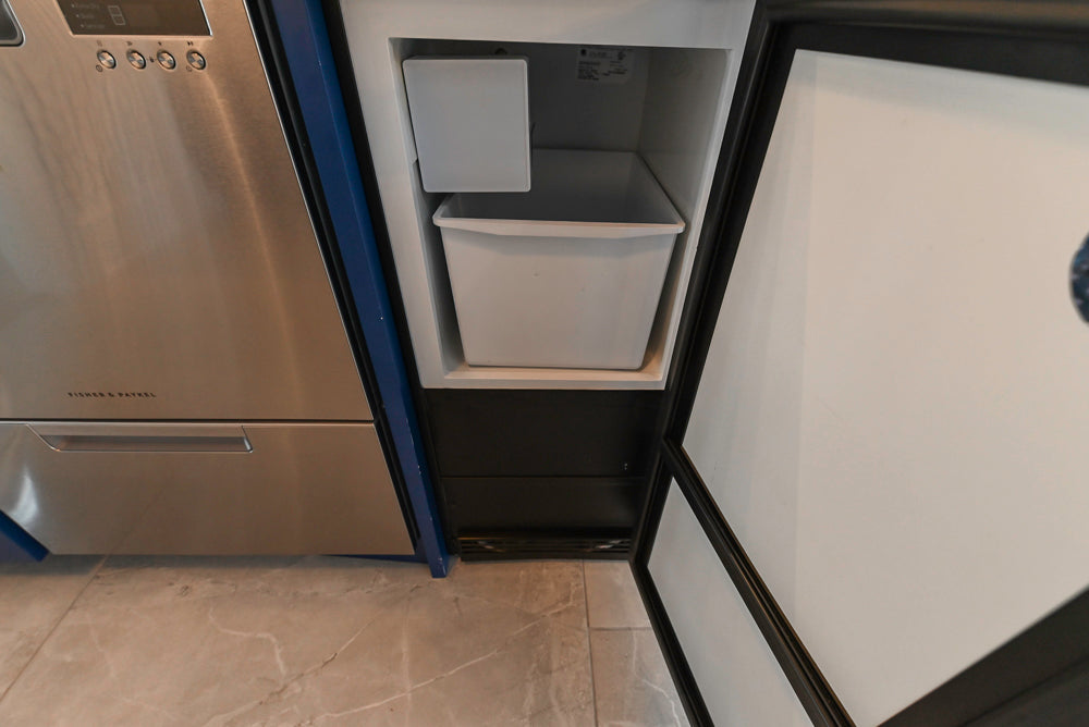 Gemcraft Navy Blue Pantry with White Quartz Countertops and Sub-Zero Tall Wine Cooler