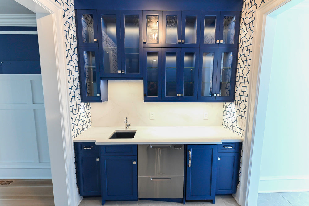 Gemcraft Navy Blue Pantry with White Quartz Countertops and Sub-Zero Tall Wine Cooler