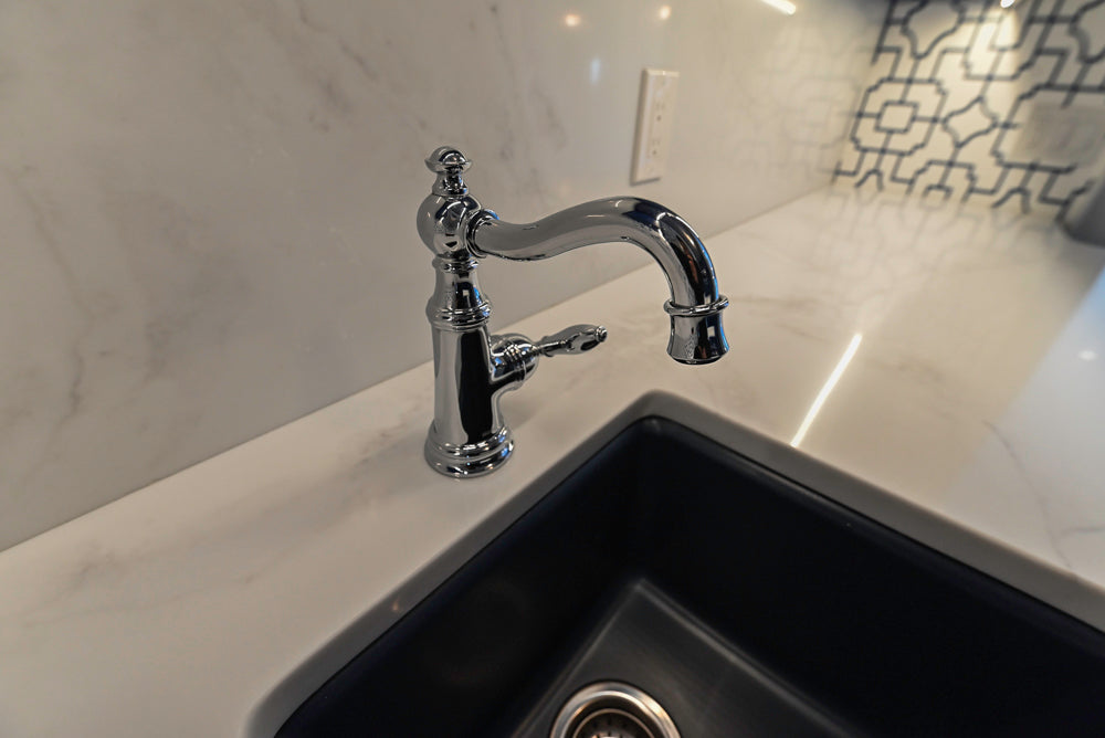 Gemcraft Navy Blue Pantry with White Quartz Countertops and Sub-Zero Tall Wine Cooler