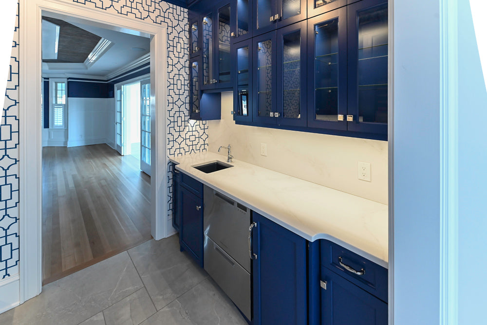 Gemcraft Navy Blue Pantry with White Quartz Countertops and Sub-Zero Tall Wine Cooler