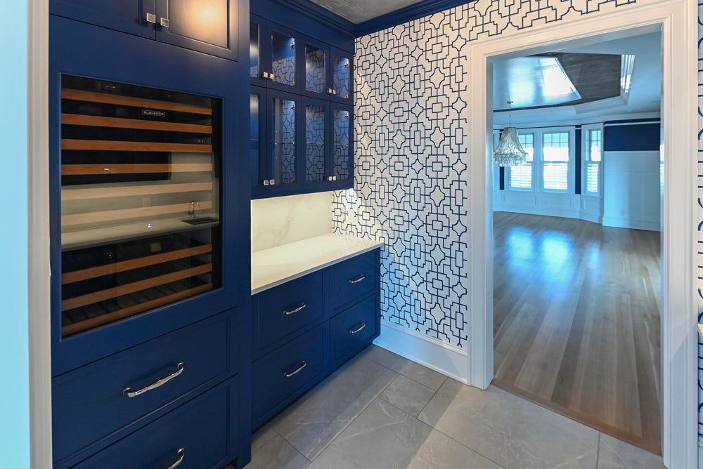Gemcraft Navy Blue Pantry with White Quartz Countertops and Sub-Zero Tall Wine Cooler