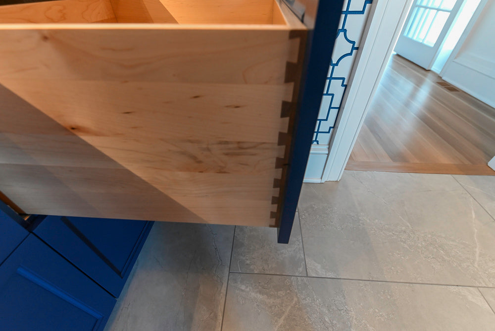 Gemcraft Navy Blue Pantry with White Quartz Countertops and Sub-Zero Tall Wine Cooler