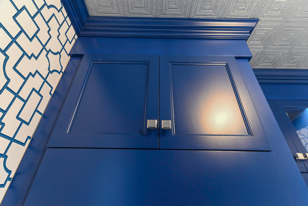 Gemcraft Navy Blue Pantry with White Quartz Countertops and Sub-Zero Tall Wine Cooler