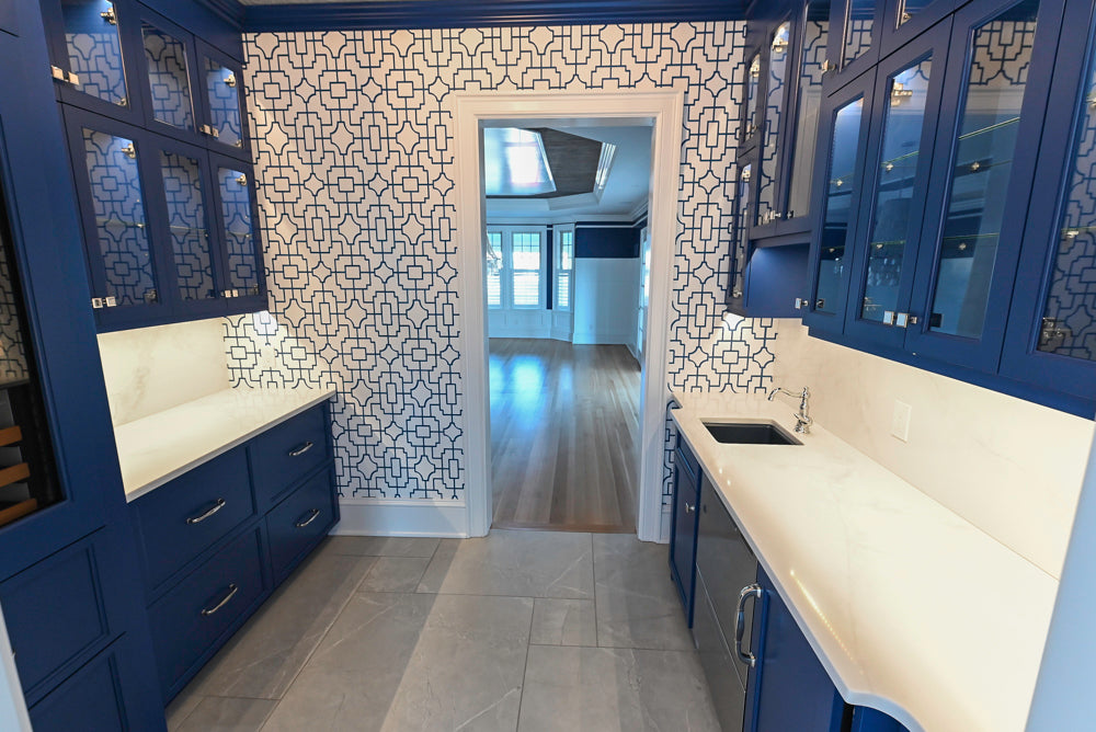 Gemcraft Navy Blue Pantry with White Quartz Countertops and Sub-Zero Tall Wine Cooler