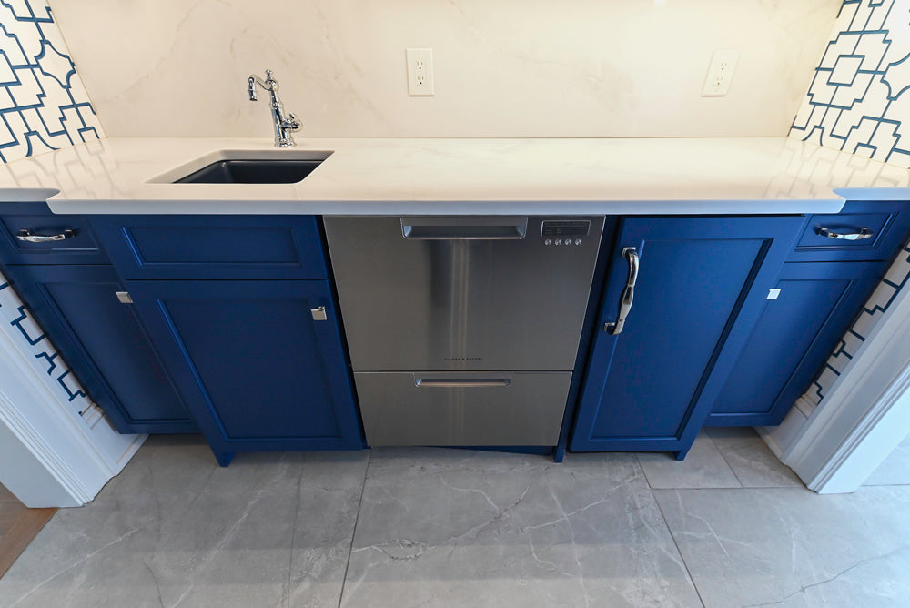 Gemcraft Navy Blue Pantry with White Quartz Countertops and Sub-Zero Tall Wine Cooler