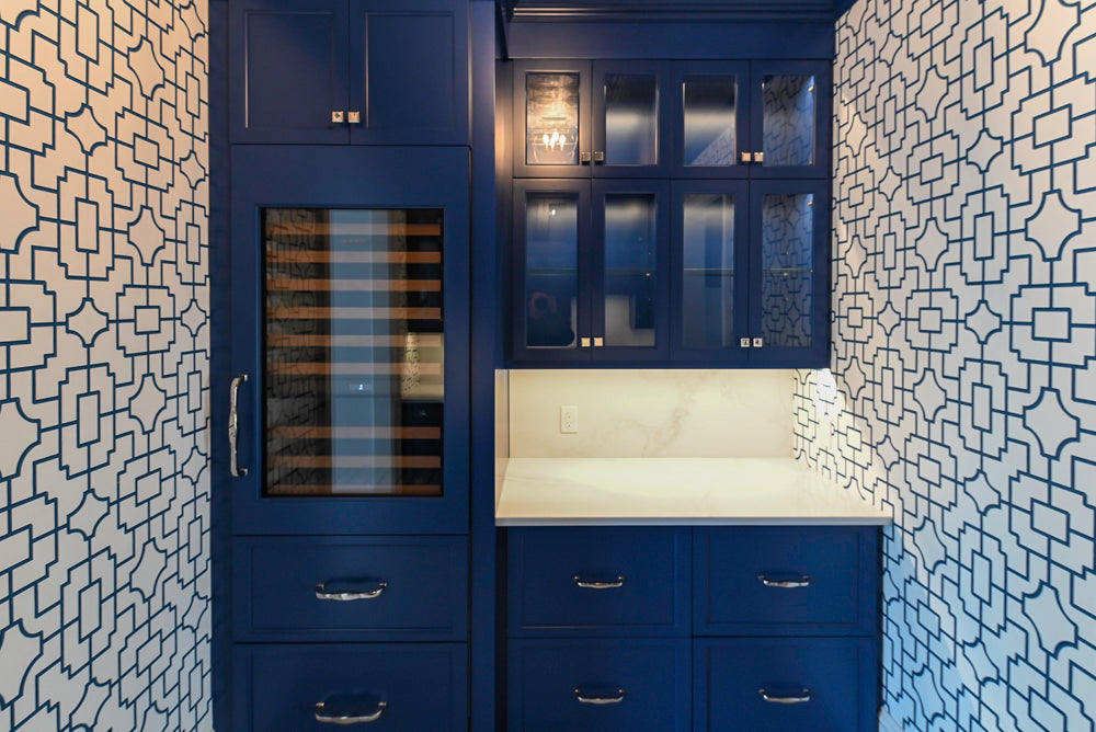 Gemcraft Navy Blue Pantry with White Quartz Countertops and Sub-Zero Tall Wine Cooler
