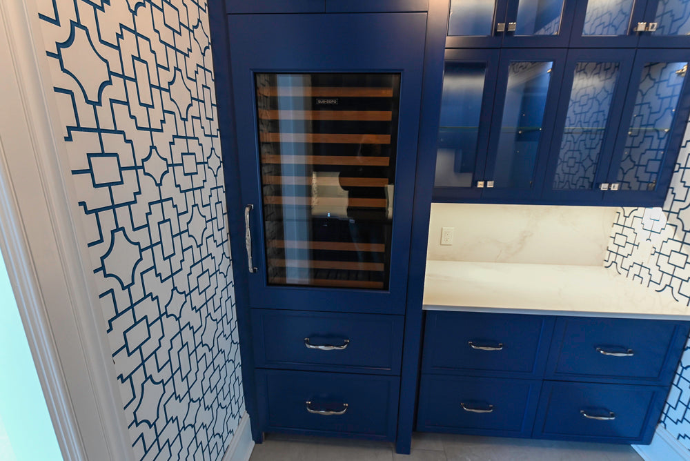 Gemcraft Navy Blue Pantry with White Quartz Countertops and Sub-Zero Tall Wine Cooler