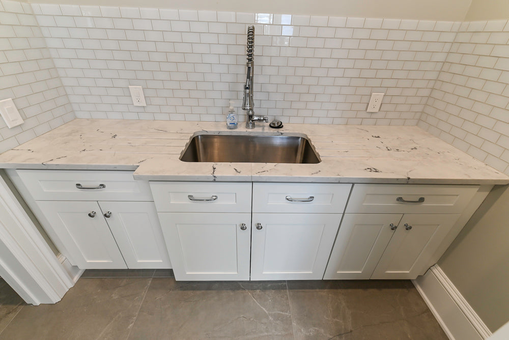 Traditional White Laundry Area with Sink, Faucet and Marble Countertops