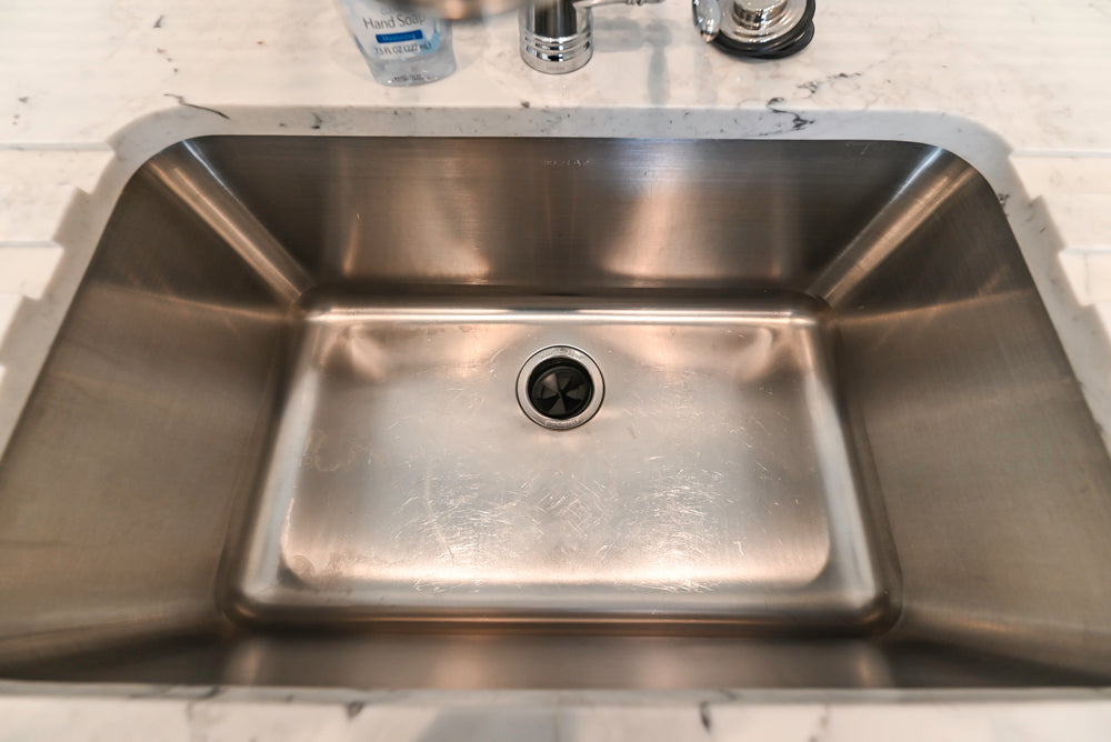 Traditional White Laundry Area with Sink, Faucet and Marble Countertops