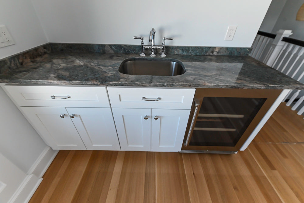 Traditional White Wet Bar with Granite Countertops and Beverage Center