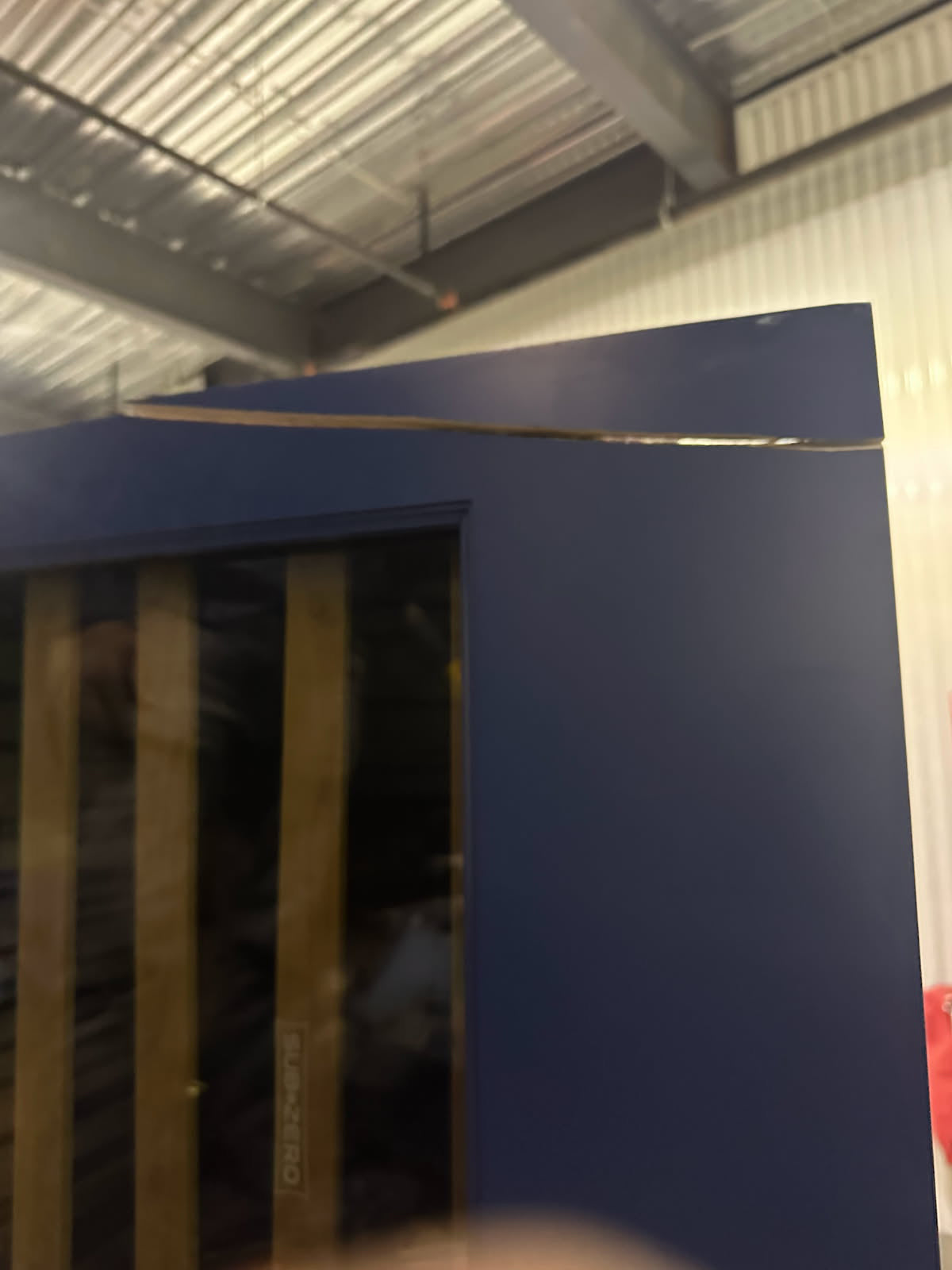 Gemcraft Navy Blue Pantry with White Quartz Countertops and Sub-Zero Tall Wine Cooler