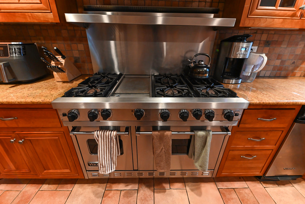 Traditional Wooden Kitchen with Island and Appliances featuring 48" Viking Range