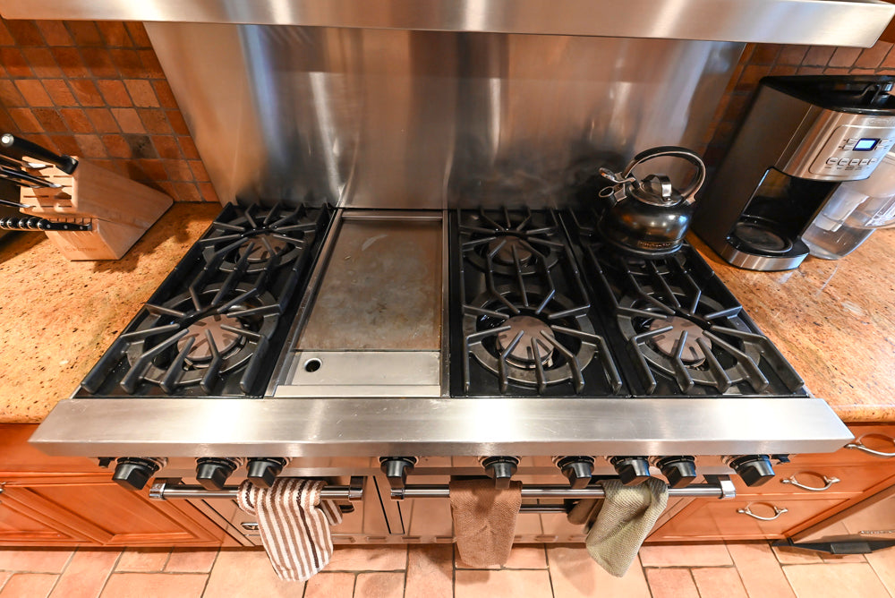 Traditional Wooden Kitchen with Island and Appliances featuring 48" Viking Range