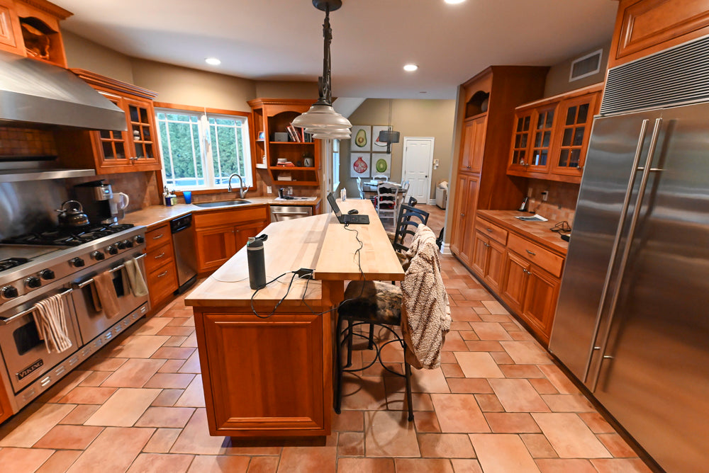 Traditional Wooden Kitchen with Island and Appliances featuring 48" Viking Range