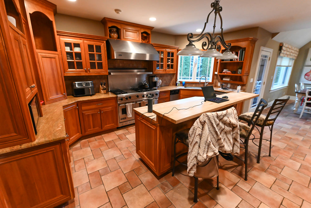Traditional Wooden Kitchen with Island and Appliances featuring 48" Viking Range