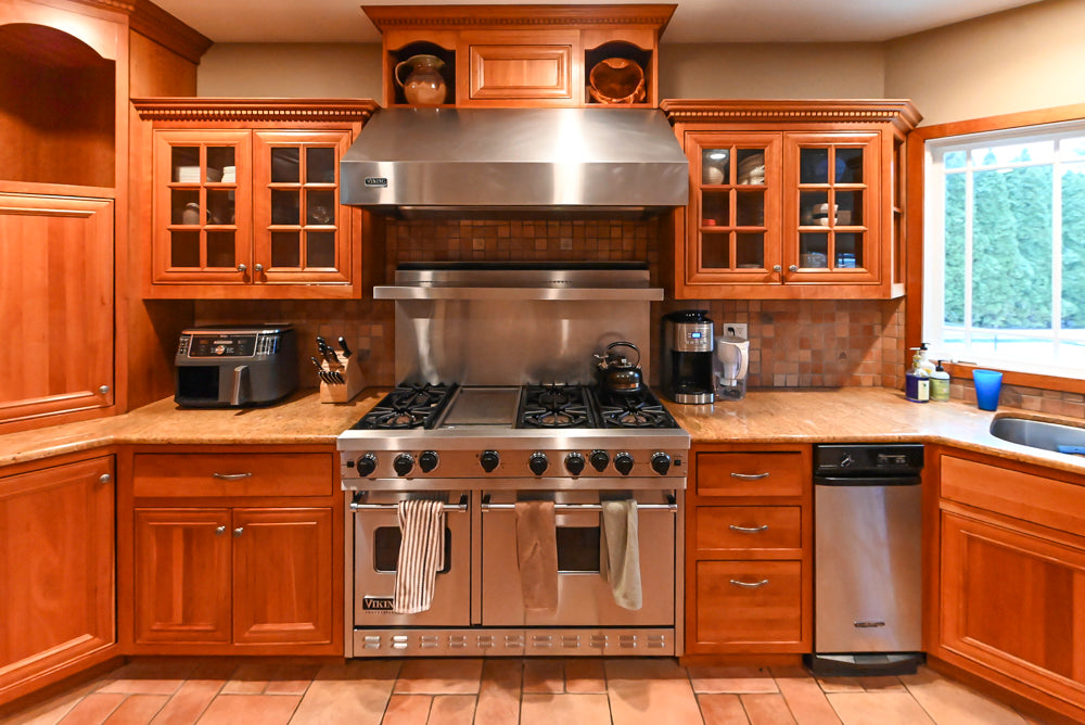 Traditional Wooden Kitchen with Island and Appliances featuring 48" Viking Range