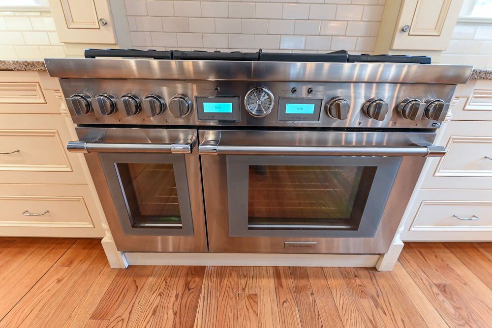 Traditional Cream Kitchen with Island, Granite Countertops & 48" Thermador Range