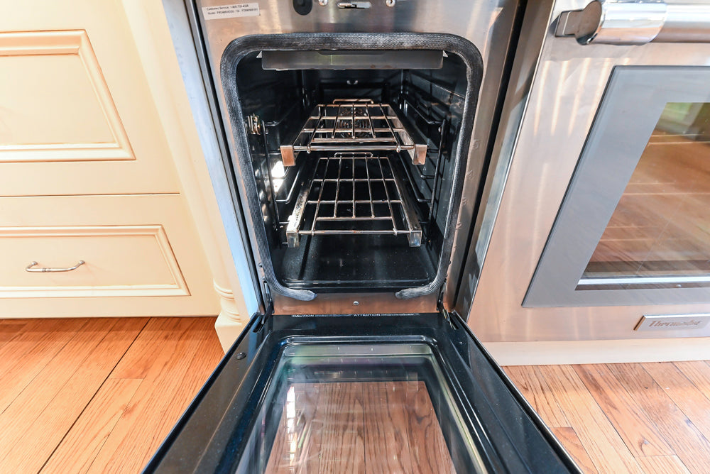 Traditional Cream Kitchen with Island, Granite Countertops & 48" Thermador Range