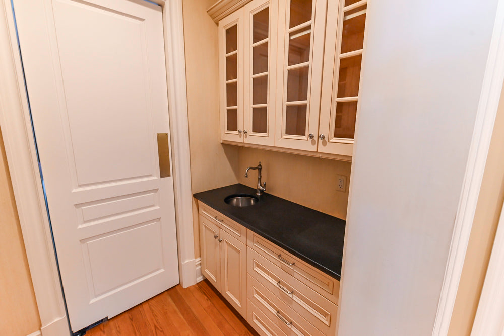 Traditional Cream Butler's Pantry with Sub-Zero Tall Wine Cooler