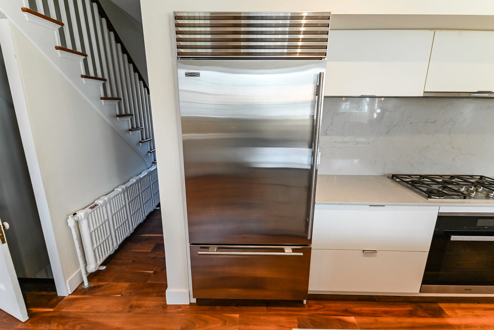 Modern Matte White Kitchen with Waterfall Island, Quartz Countertops & Miele Appliances