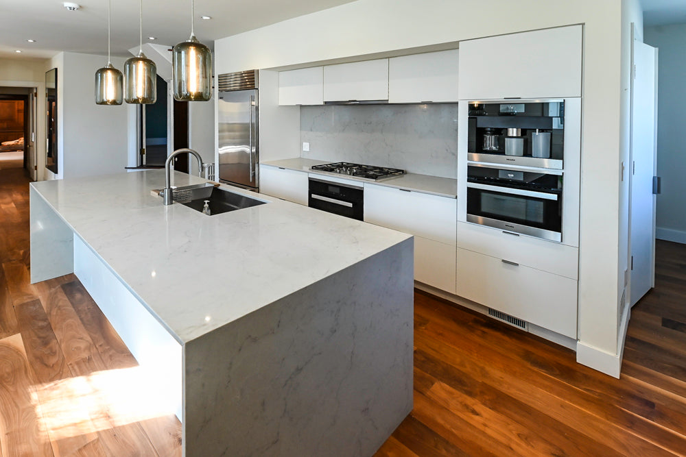 Modern Matte White Kitchen with Waterfall Island, Quartz Countertops & Miele Appliances