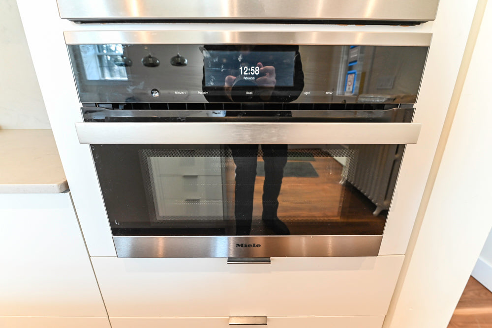 Modern Matte White Kitchen with Waterfall Island, Quartz Countertops & Miele Appliances