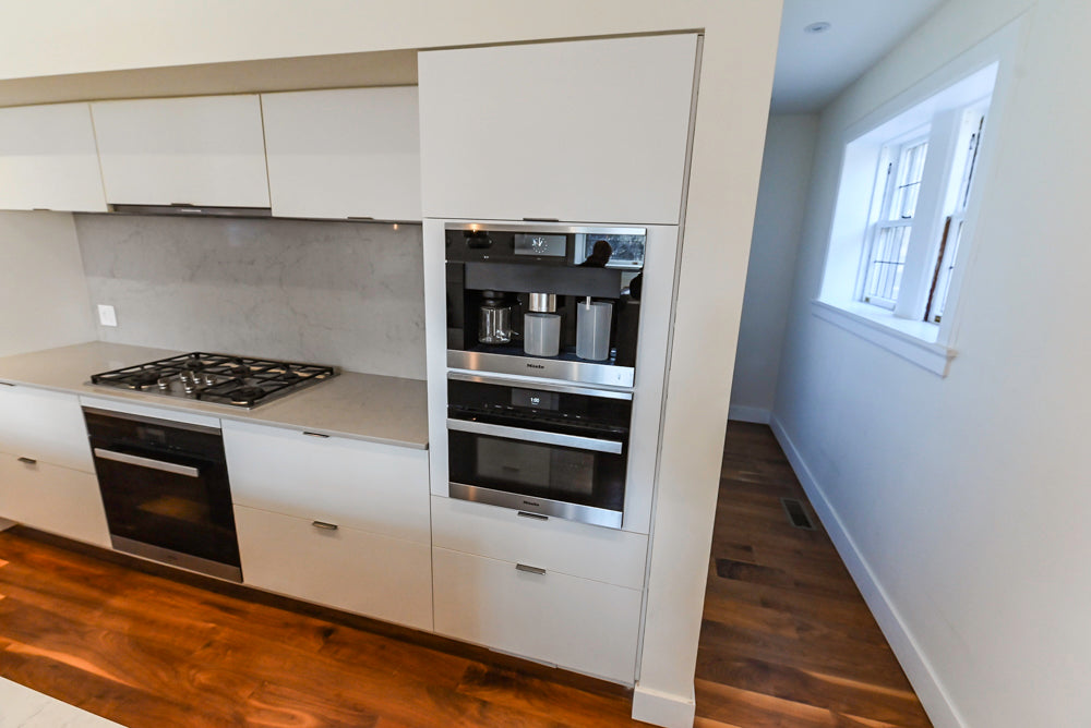 Modern Matte White Kitchen with Waterfall Island, Quartz Countertops & Miele Appliances